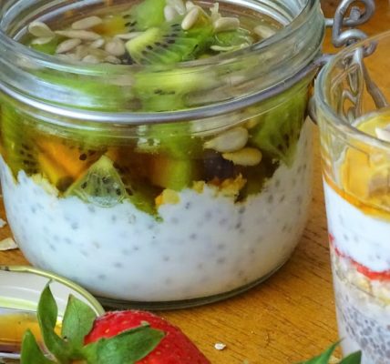 Delicious chia seed parfaits topped with fresh kiwi, strawberries, and sunflower seeds.